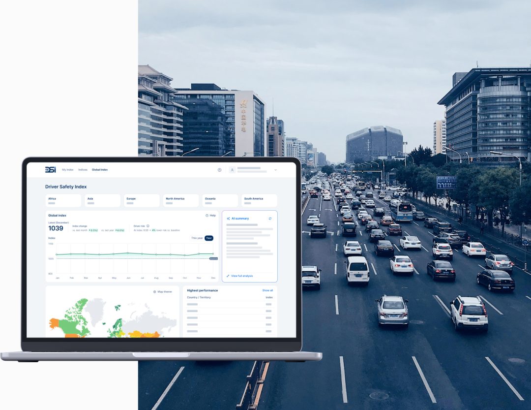 FIA Driver Safety Index Platform displayed on a laptop screen with heavy city traffic on a multi-lane urban road in Asia in the background.