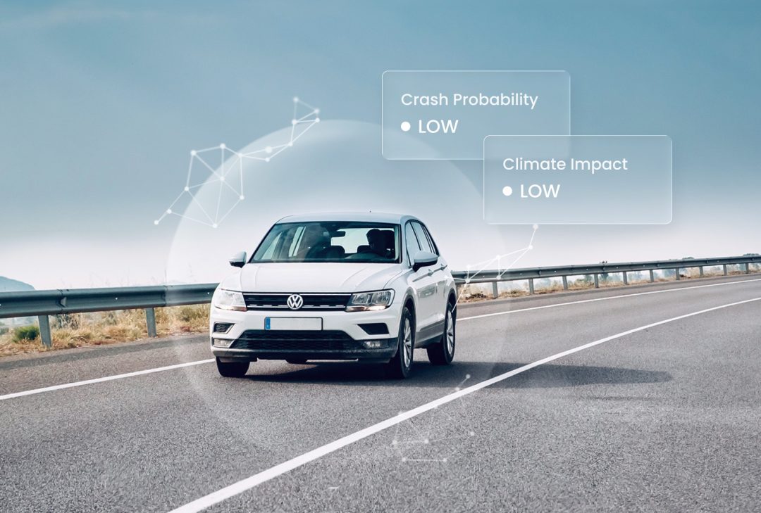 White Volkswagen SUV driving on a curved highway with AI-generated overlay indicating low crash probability – visualizing Greater Than’s AI-powered driver risk analysis.